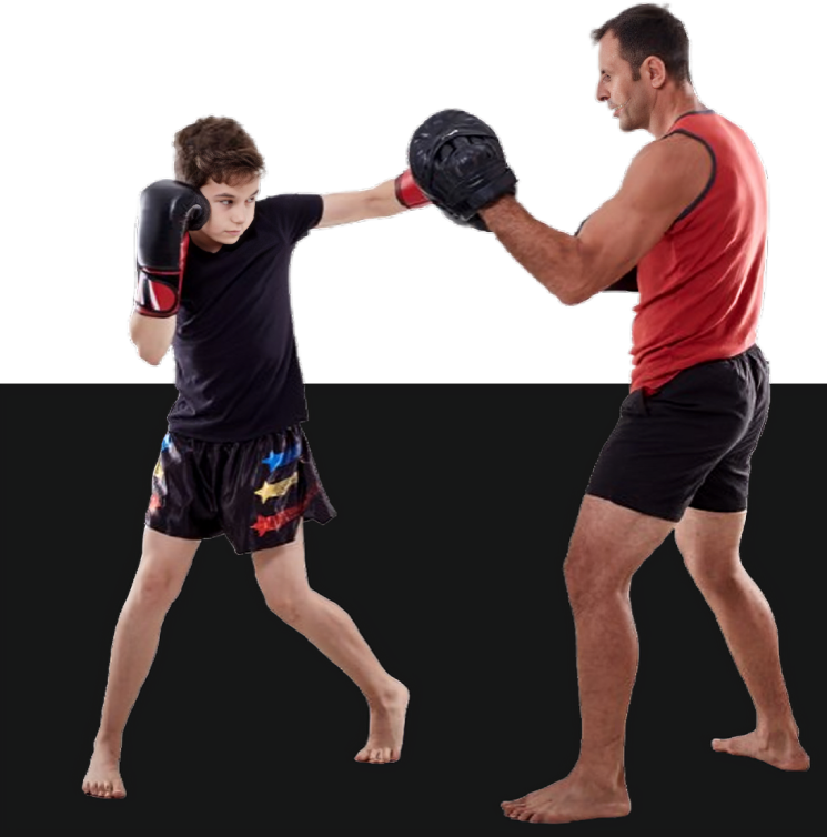 Boy practicing boxing with a trainer.