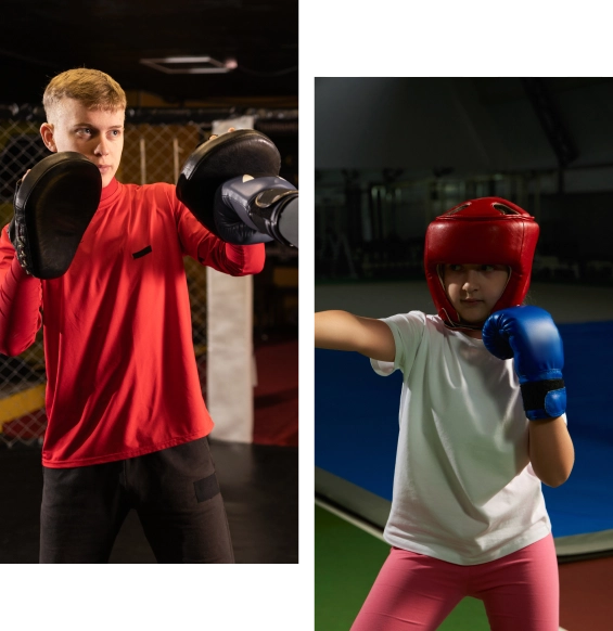 Two people practicing boxing with gear.